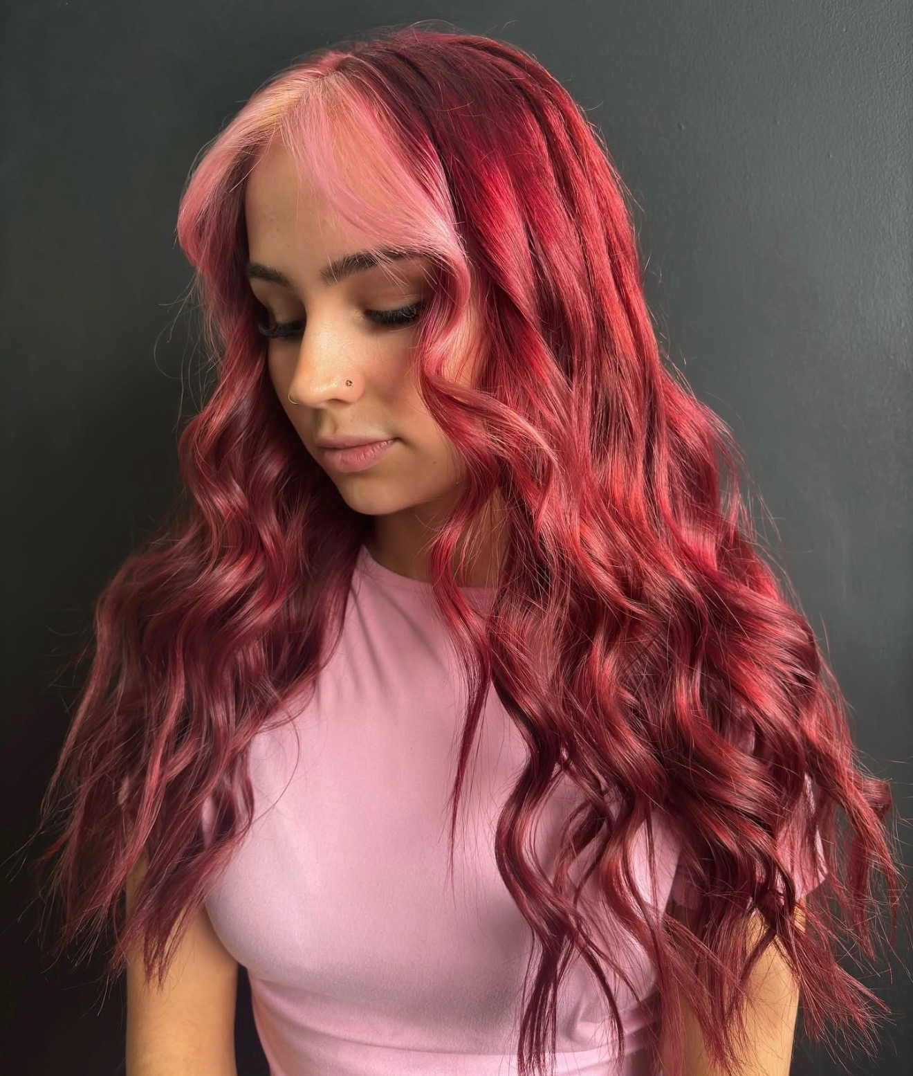 Vivid pink and red fantasy hair color