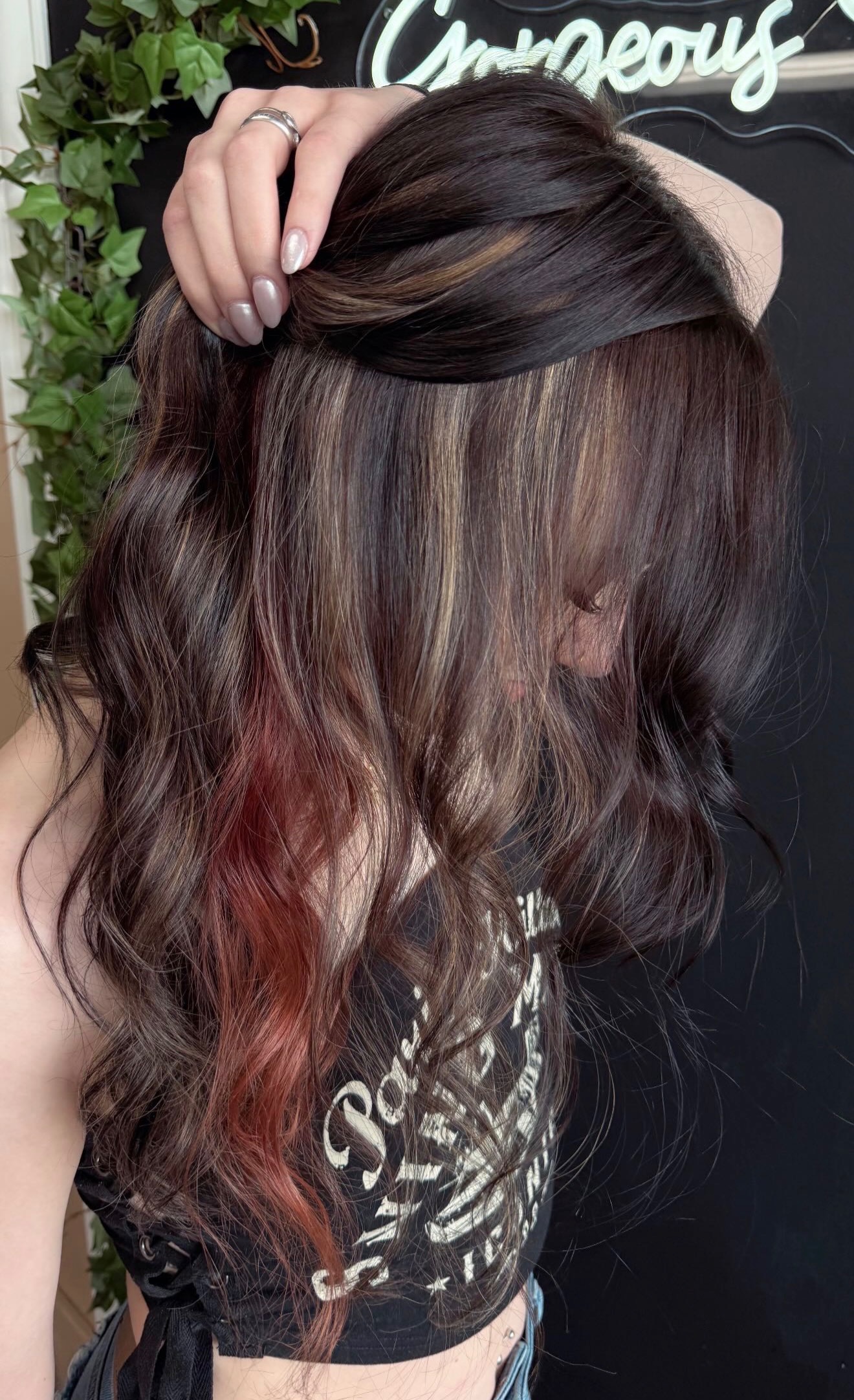 Brunette with red peek-a-boo color underneath